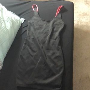 Simple black dress, hot pink detail on the back